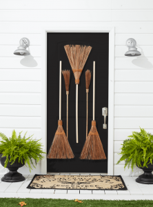 brooms on a front door